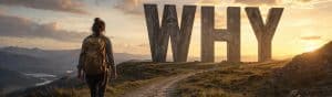A person standing on a trail looking at large "WHY" letters during sunset, symbolizing purpose and motivation in personal and professional growth.