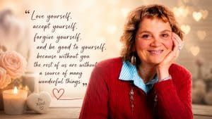 Woman smiling with a heartfelt quote about self-love, acceptance, and forgiveness, set against a warm, cozy background with candles and soft lighting.