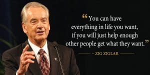 Image of Zig Ziglar speaking at an event, emphasizing the importance of helping others to achieve personal success.