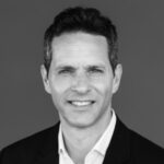 Professional headshot of a confident businessman showcasing leadership for Difference Makers Media.