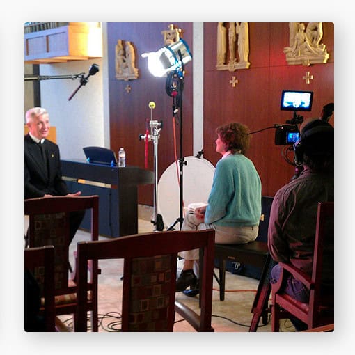 Interview scene for Story Empowerment post, featuring a woman sharing her story with a media crew in a professional setting. Focus on storytelling, empowerment, and media production.